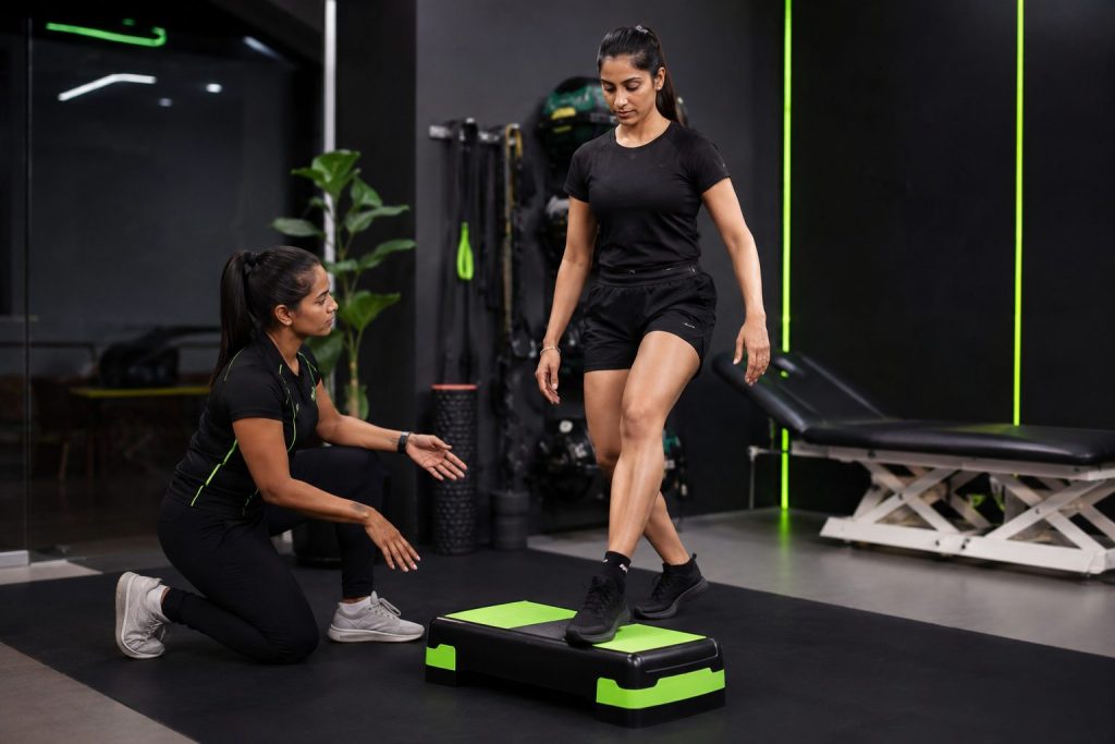 Knee Pain Assessment: runner completing a controlled step-down assessment