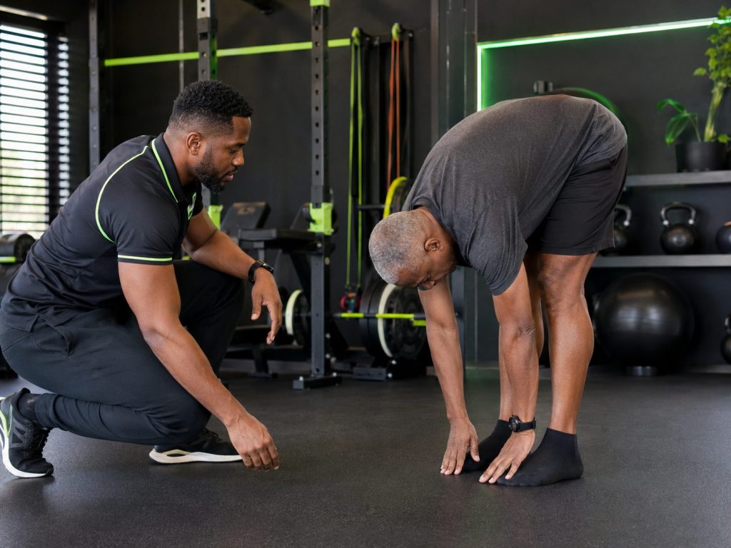 Movement Not Just Imaging: toe-touch movement screen with physiotherapist